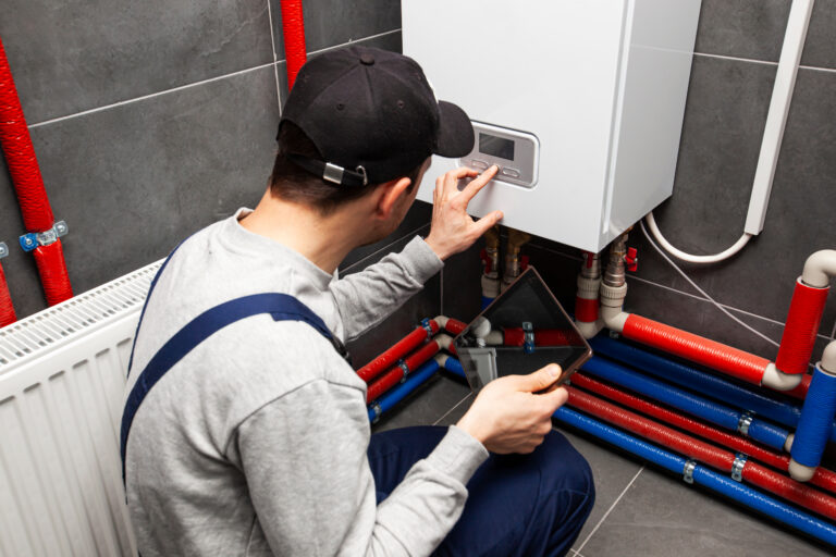 The technician is demonstrating how to how to repressurise a boiler